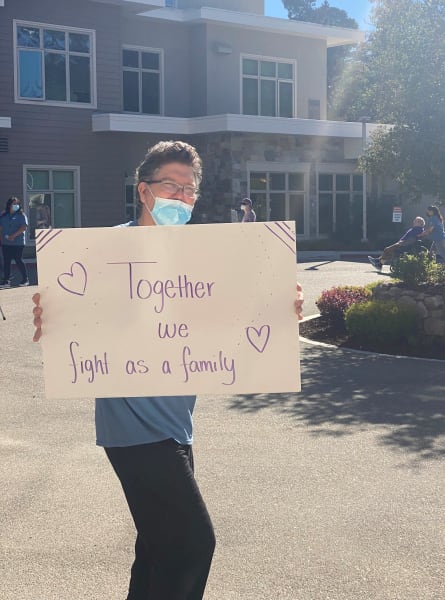 Monterey (CA) team member shows off his sign to support the walk.