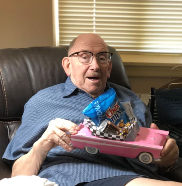 One resident poses with his personalized classic car goody bag.