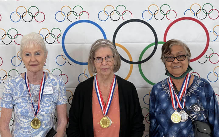 Residents at Solivita Marketplace got their photos taken after receiving their medals!