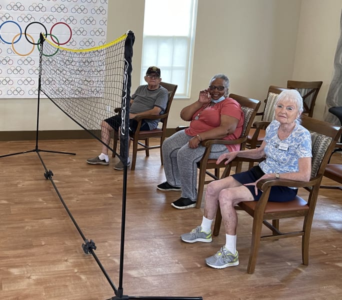 At Solivita Marketplace, the first team of three set up their chairs for beach ball volleyball.