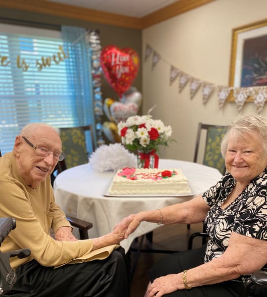 Team members set up decorations and made a tasty cake for Bertha and John's 70th anniversary! 