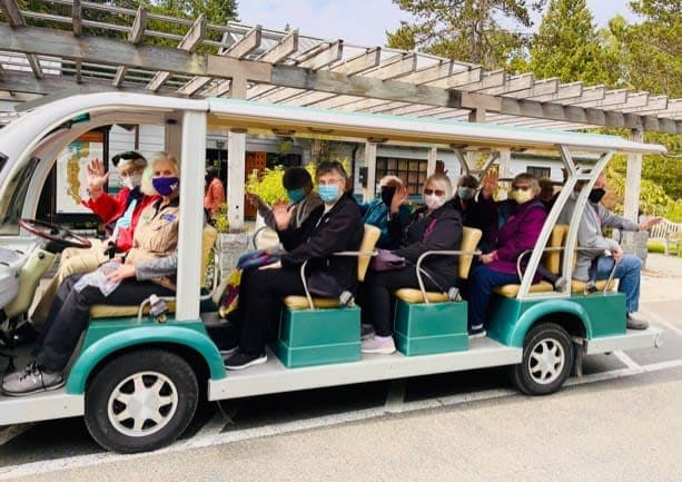 Ballard residents embark on the tram for a fun-filled tour of the University of Washington Botanical Gardens.