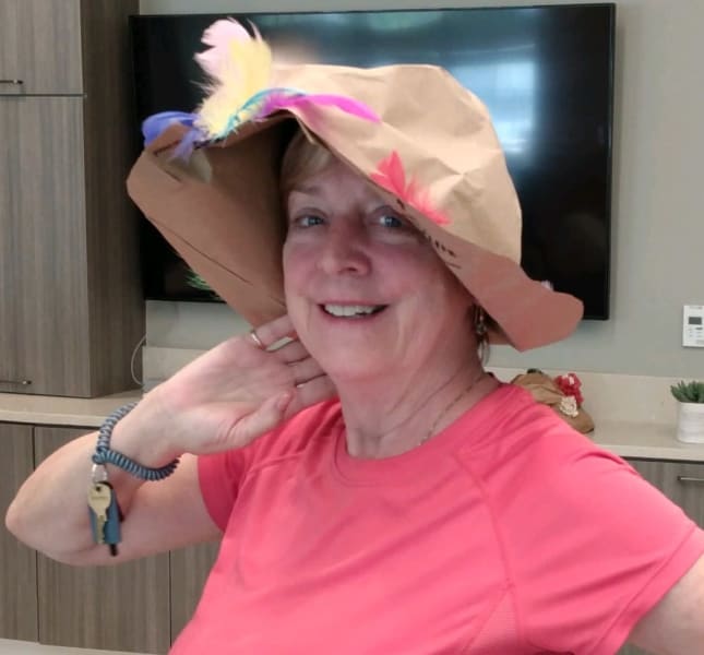 Model time! One Carolina Park resident poses with her paper bag hat.