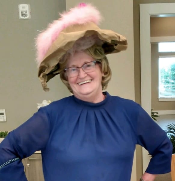 A Carolina Park resident shows off her paper bag hat.