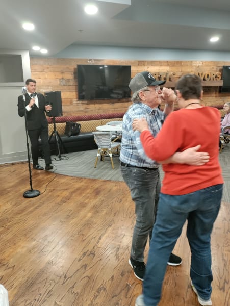 A charming Park Central couple takes to the dance floor while a local musician performs.