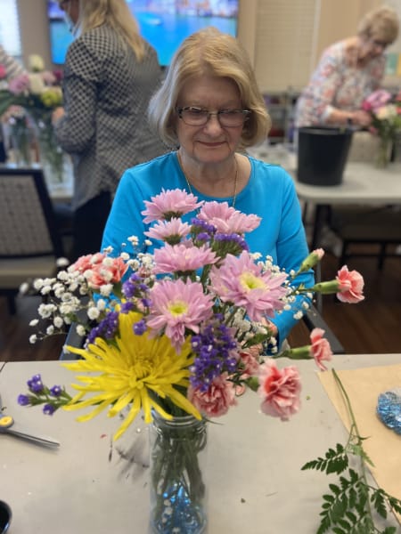 A Tacoma resident focuses on her flowers as she creates her first arrangement.