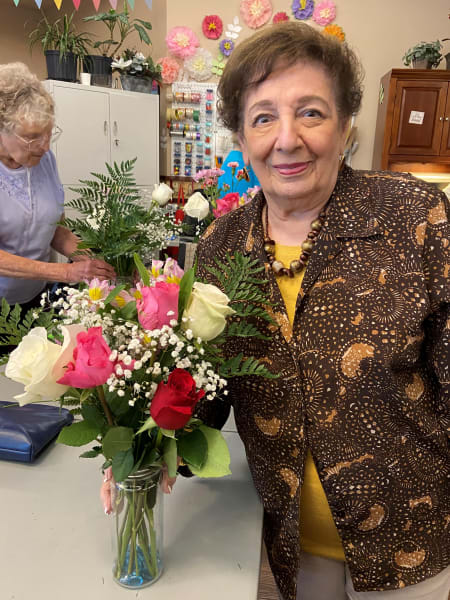 A Tacoma resident focuses on her flowers as she creates her first arrangement.