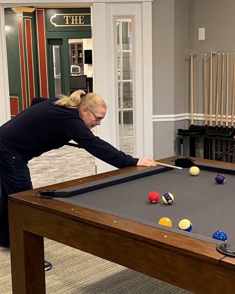 Glen Mills (PA) resident takes a shot on the pool table.