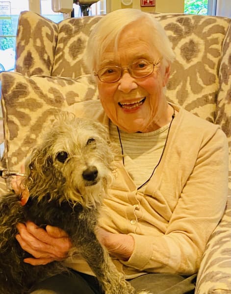 A First Hill resident snuggles up with a cute pup!