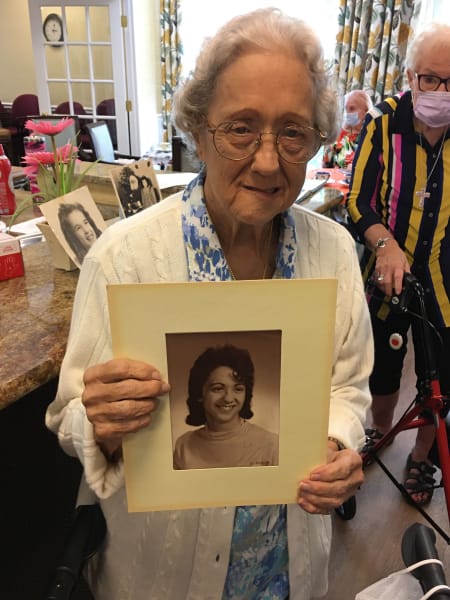 Barkley Place residents show off their old school photos.