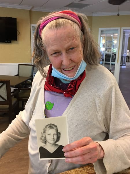 Barkley Place residents show off their old school photos.