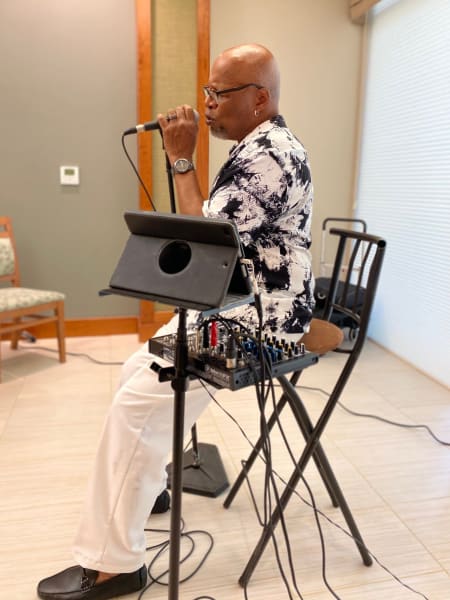 Local jazz singing legend Michael King puts on a show for the residents.