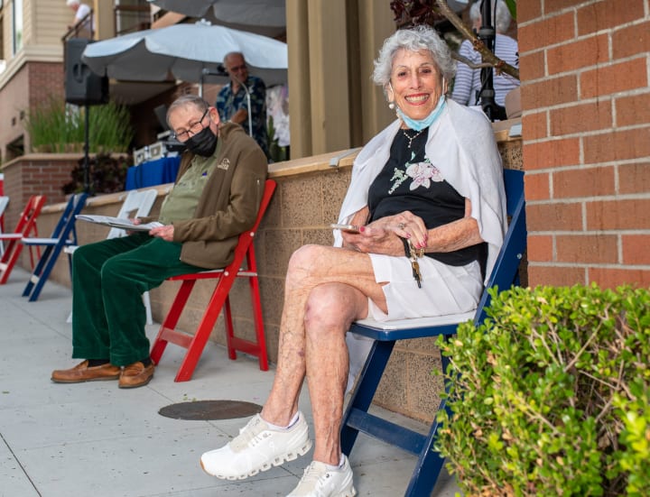 Bankers Hill residents take a seat after getting their booster shots.