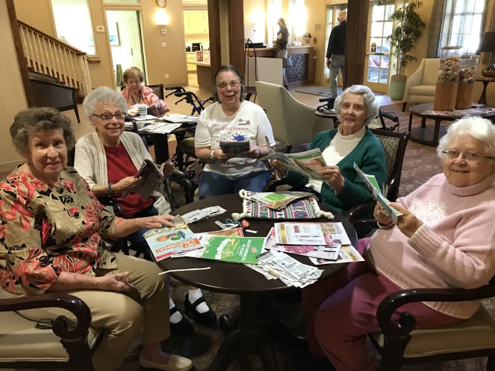 Oceanside residents clipping coupons for military families. 