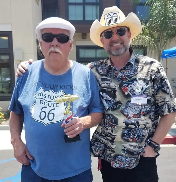 General Manager, David Tamo and resident with a car show trophy 