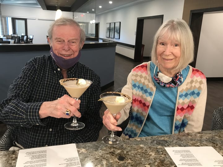 An Eagleview Landing couple enjoy some specialty smores cocktails.