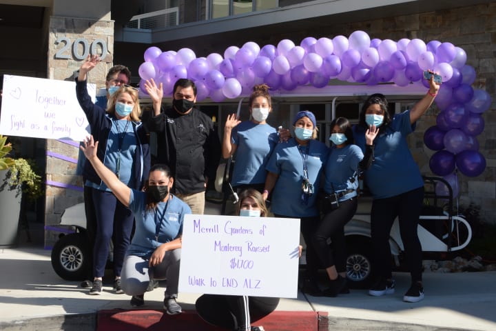 The Monterey (CA) team poses outside the entrance to the community.