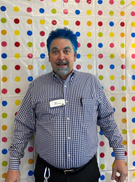 Merrill Gardens at Tacoma General Manager Rob steps into the photo booth for Crazy Hair Day.