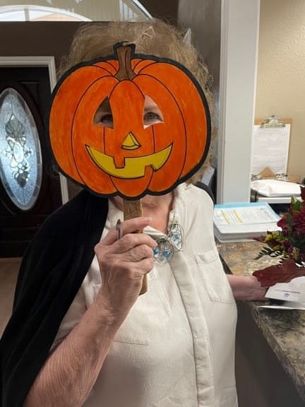 Waterview Court residents loved posing for photos with a fun pumpkin mask!