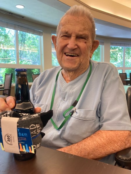 A Cottonwood Heights (UT) resident poses with his bottle of Dad's Root Beer.