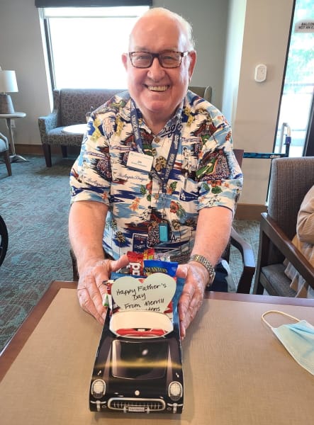 A West Covina (CA) resident shows off his classic car-themed goody bag.