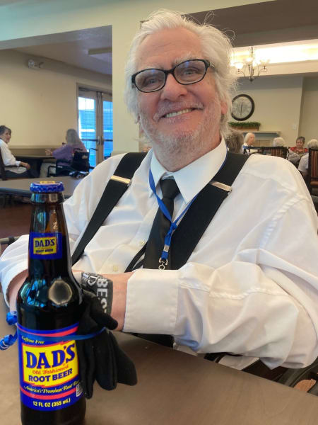 A Cottonwood Heights (UT) resident poses with his bottle of Dad's Root Beer.