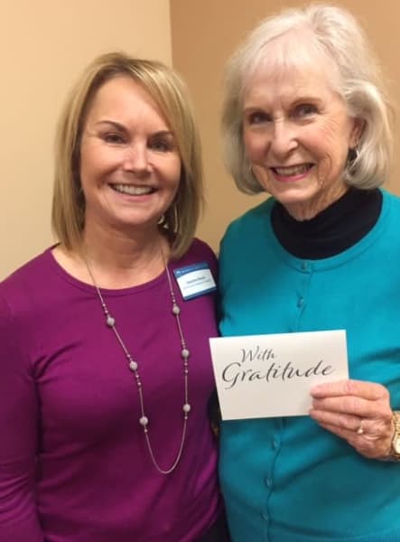 Resident and team member smiling at Merrill Gardens