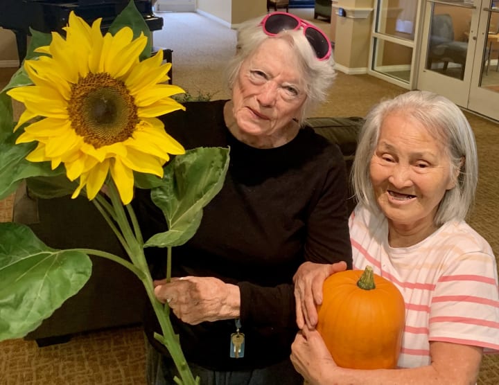 Residents enjoying their garden finds at Merrill Gardens at First Hill