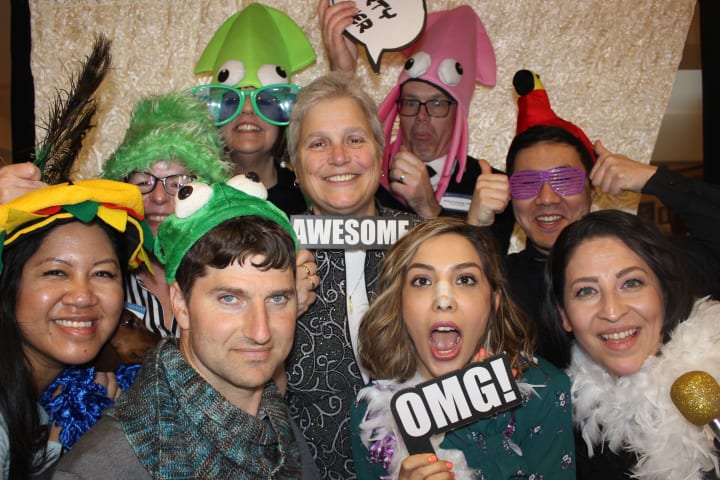 Team members celebrate at Merrill Gardens at The University in Seattle