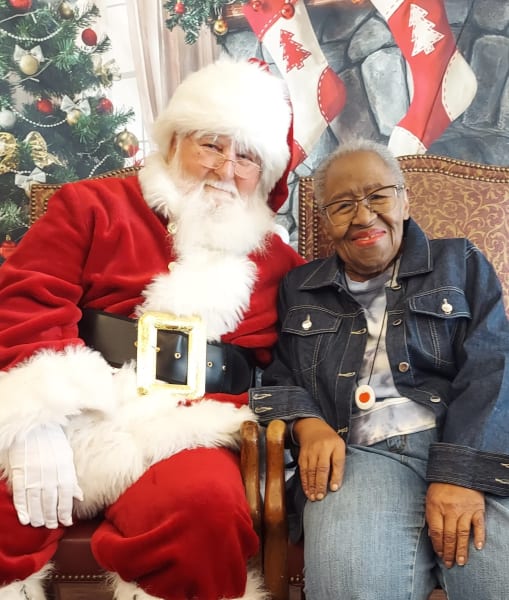 A River Park (TX) resident enjoys her time with Santa